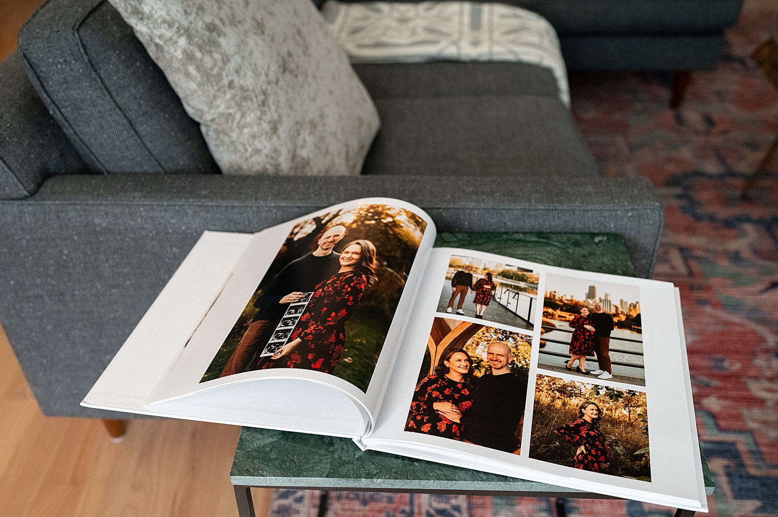 A baby book sits open to pregnancy photos.