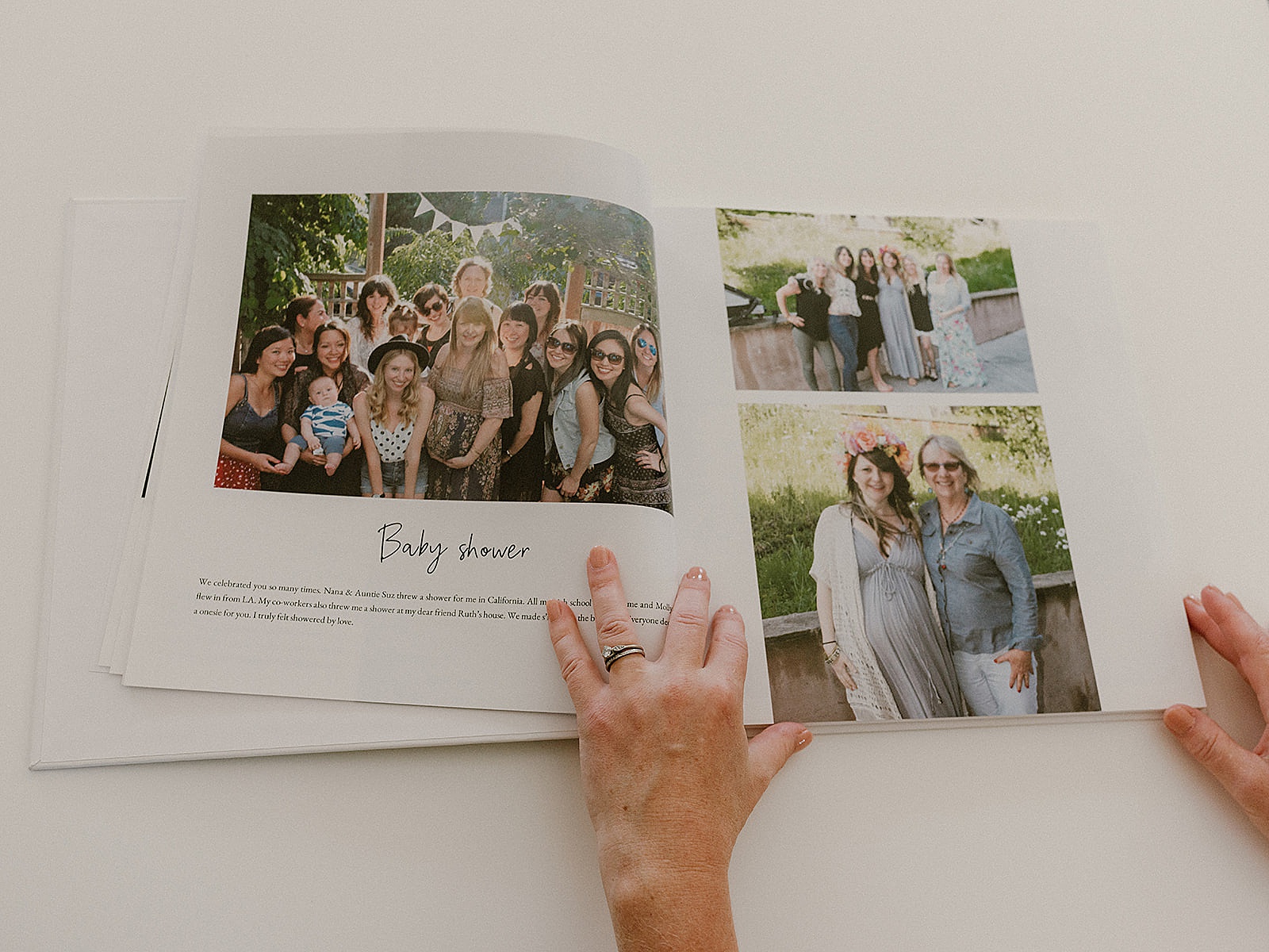 A pregnancy journal sits open to an entry about a baby shower.