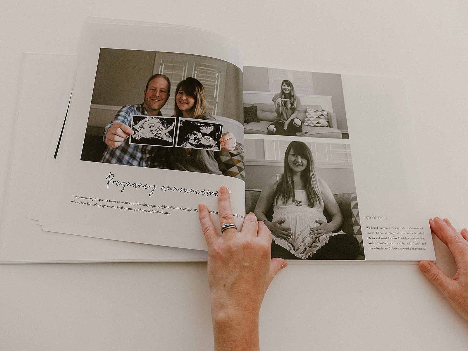 A digital baby book shows a couple holding up a sonogram.