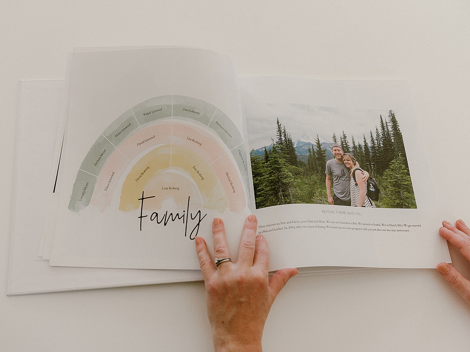 A photo book for baby is open to a family tree.