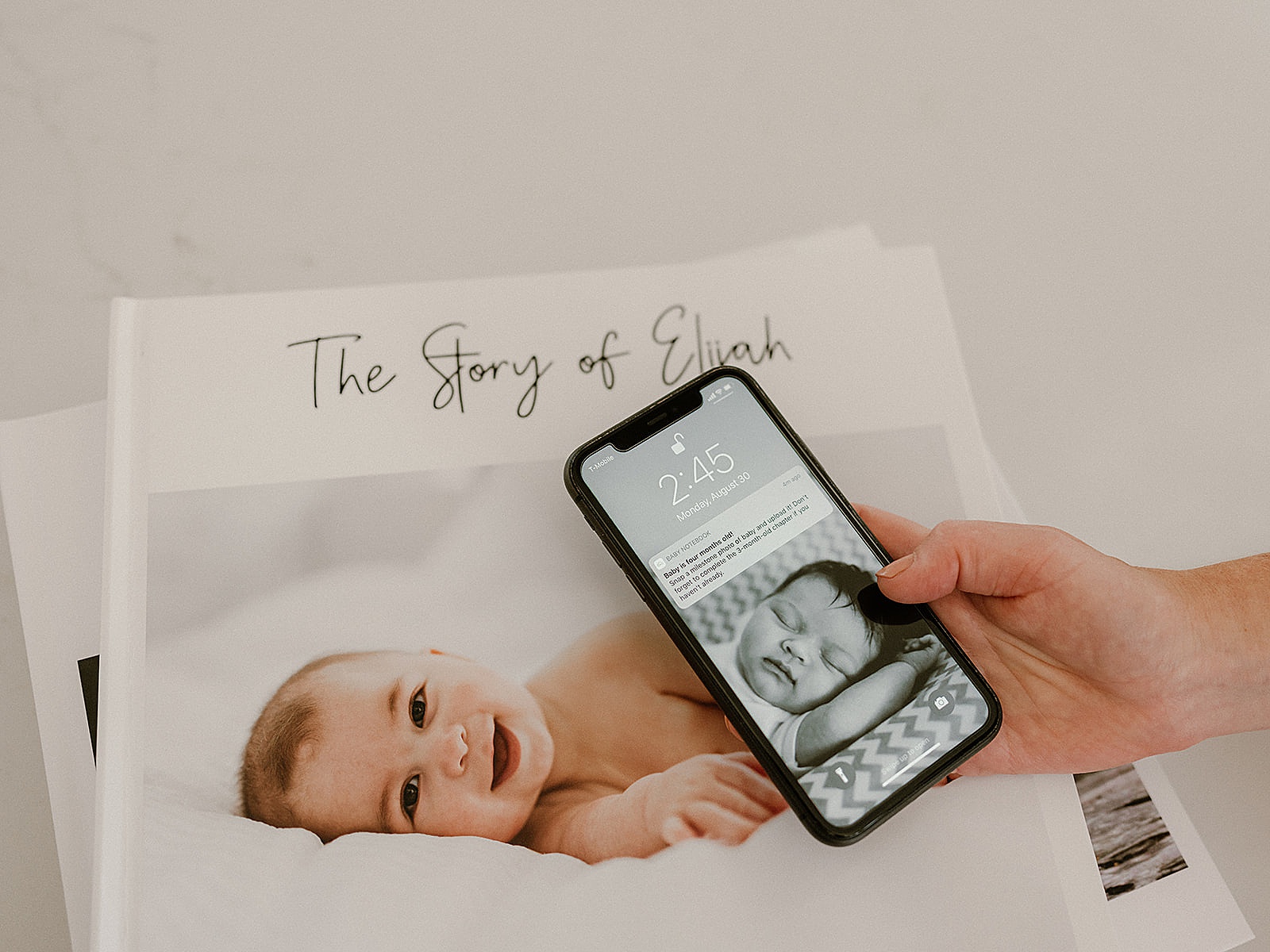 A woman scrolls through a keepsake app on her phone.