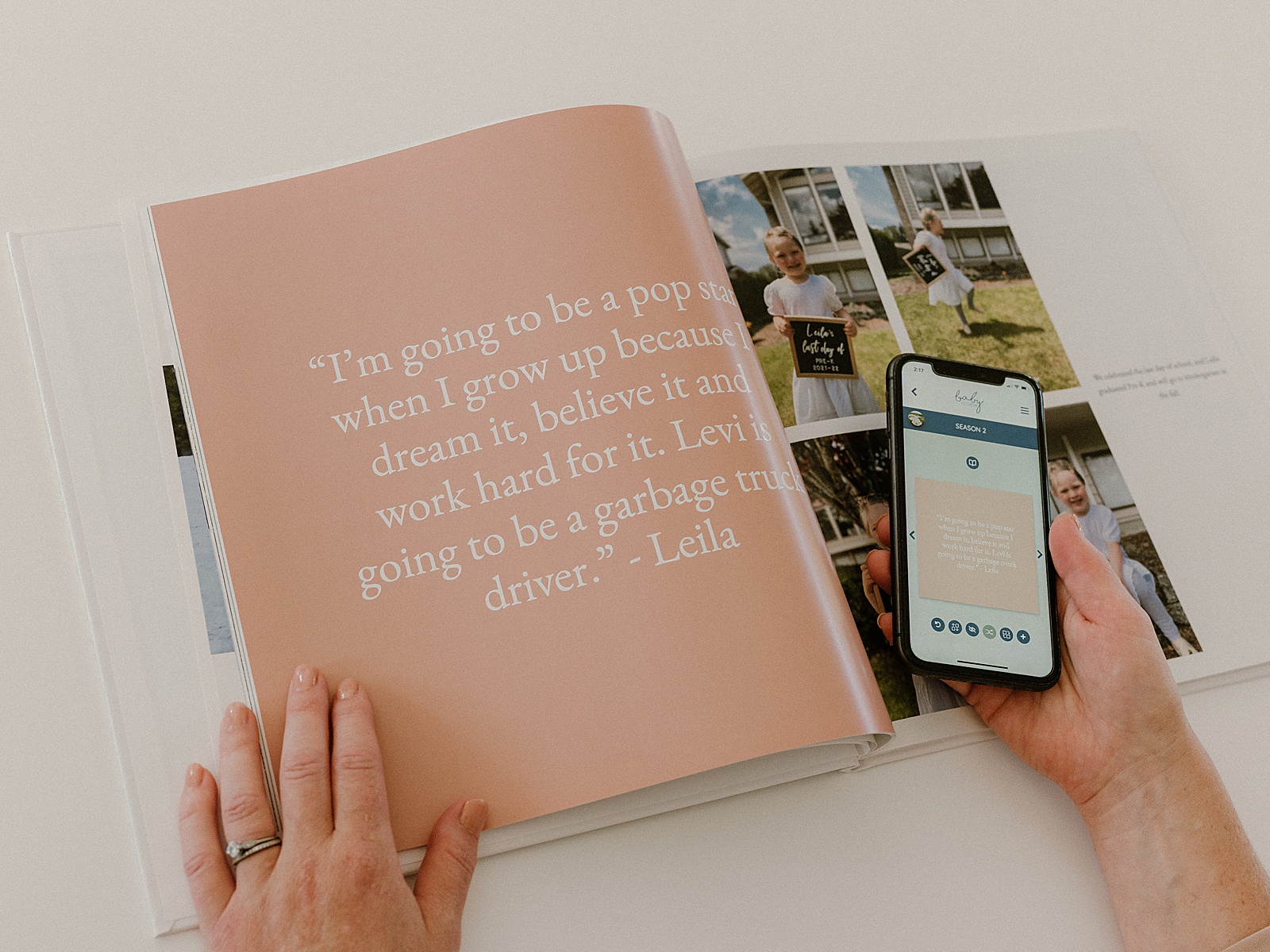 Someone opens a memory book to a quotes page.